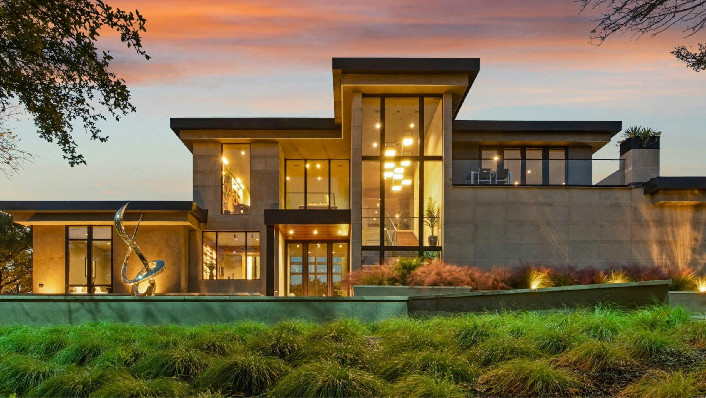 Modern Wichita-area home renovated by One America Construction, lit at dusk